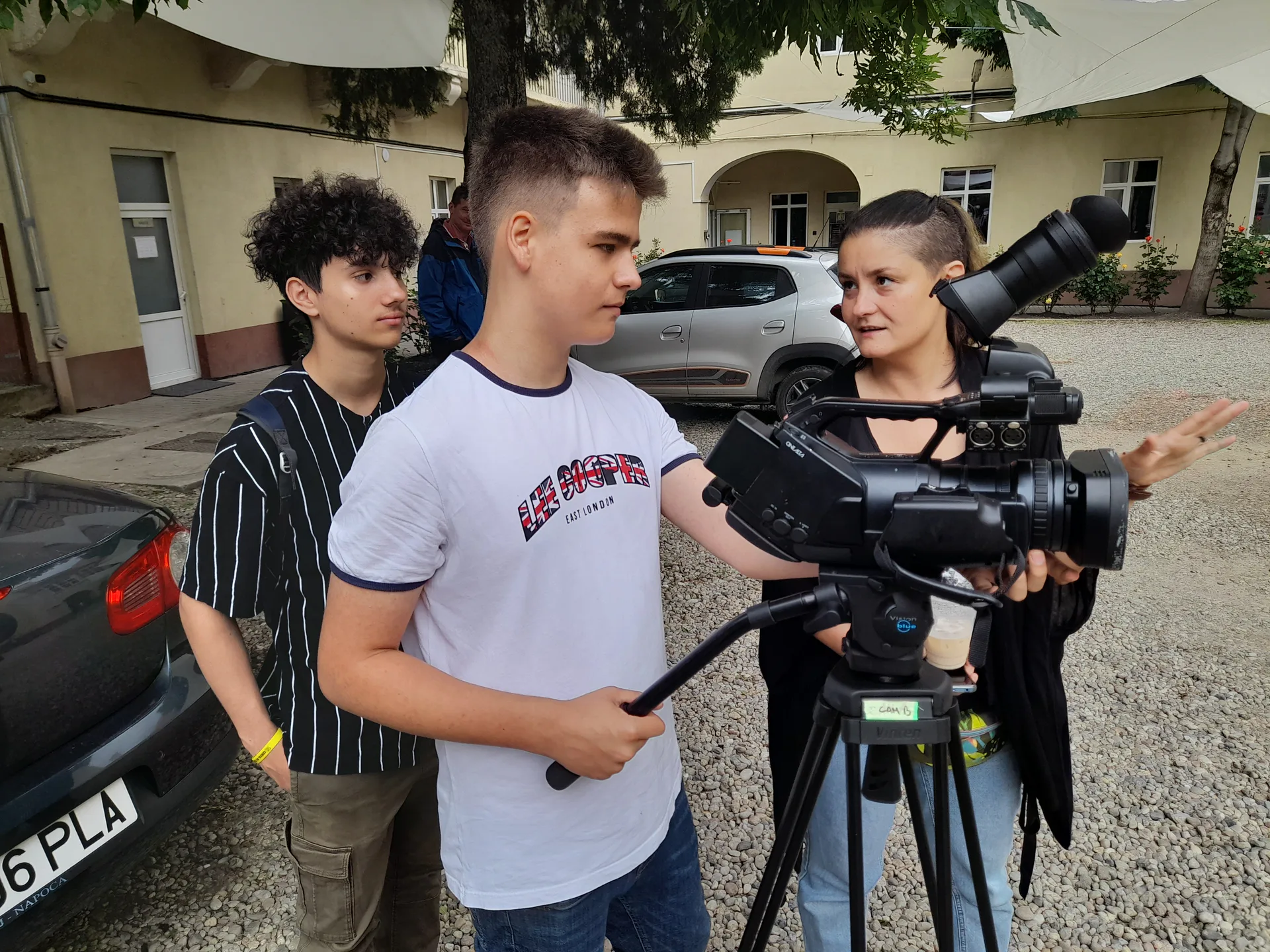Young people learning television presenting and filming with a professional camera in Cluj-Napoca